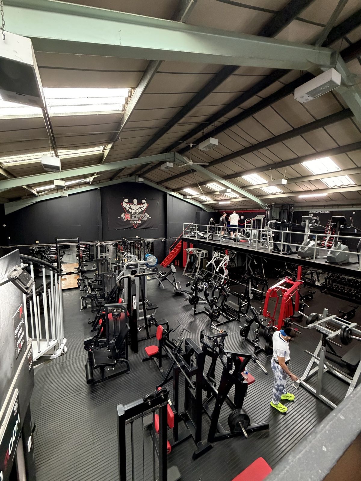 Free weights and strength machines on the floor at Repz Gym